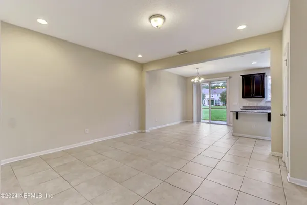 a view of an empty room with a fireplace