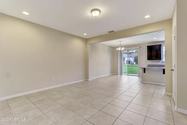 a view of an empty room with a fireplace