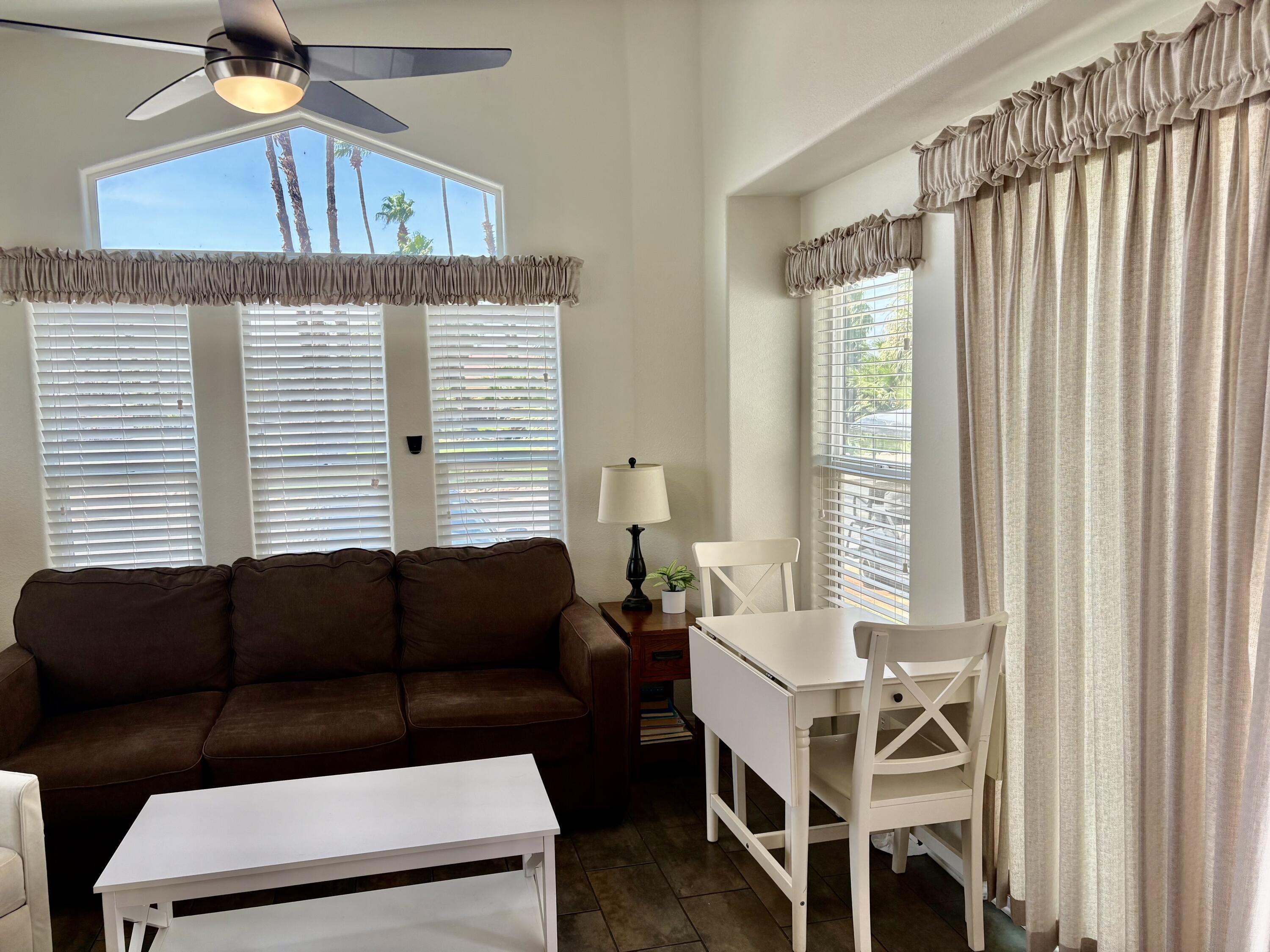 74711 Dillon Road, Unit 247 Desert Hot Springs, CA 92241 - Photo 5 of 33 a living room with furniture and a window
