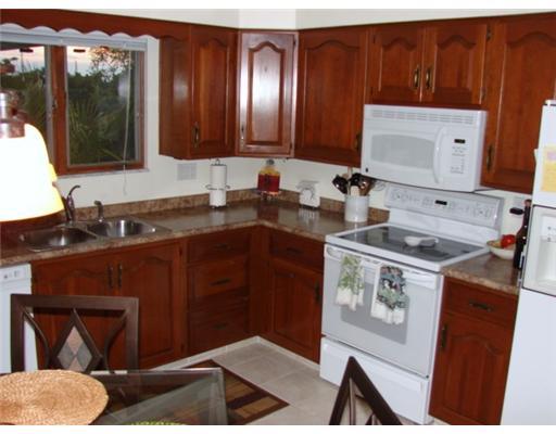 29 1/2 Flora Road Baldwin, PA 15227 - Photo 5 of 18 Kitchen. Eat in Kitchen for 29 Flora. Cherry Cabinets and Ceramic Tille Floor! Smooth cook top electric stove, Microwave/Convection Oven, Dishwasher, Refrigerator and Disposal are all included.