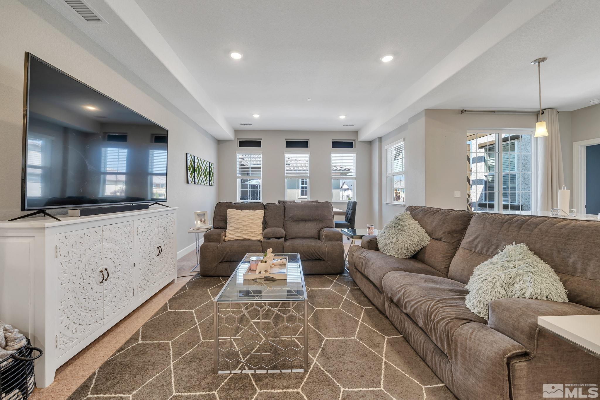 1914 Sea Horse Road, Unit A Reno, NV 89521 - Photo 11 of 28 a living room with furniture and a flat screen tv