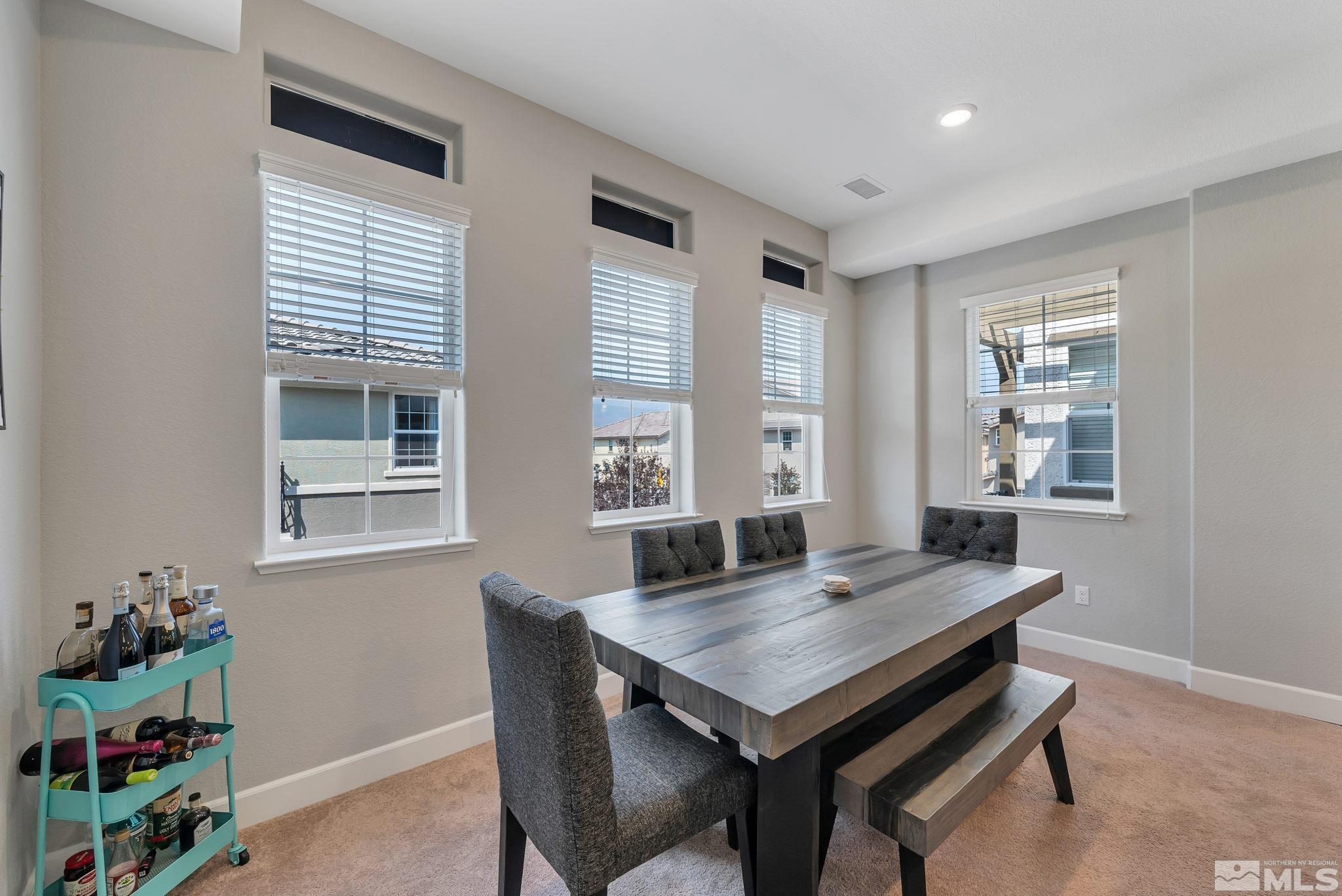 1914 Sea Horse Road, Unit A Reno, NV 89521 - Photo 12 of 28 a view of a dining room with a table and chairs