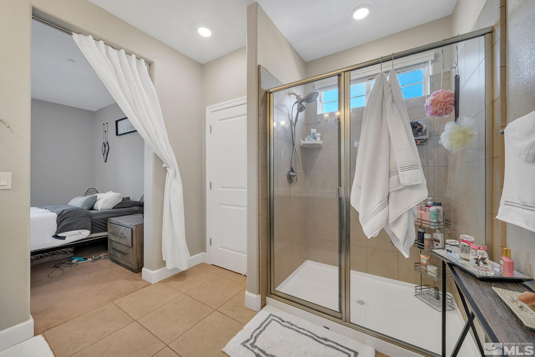1914 Sea Horse Road, Unit A Reno, NV 89521 - Photo 18 of 28 a very nice looking room with a glass door and shower