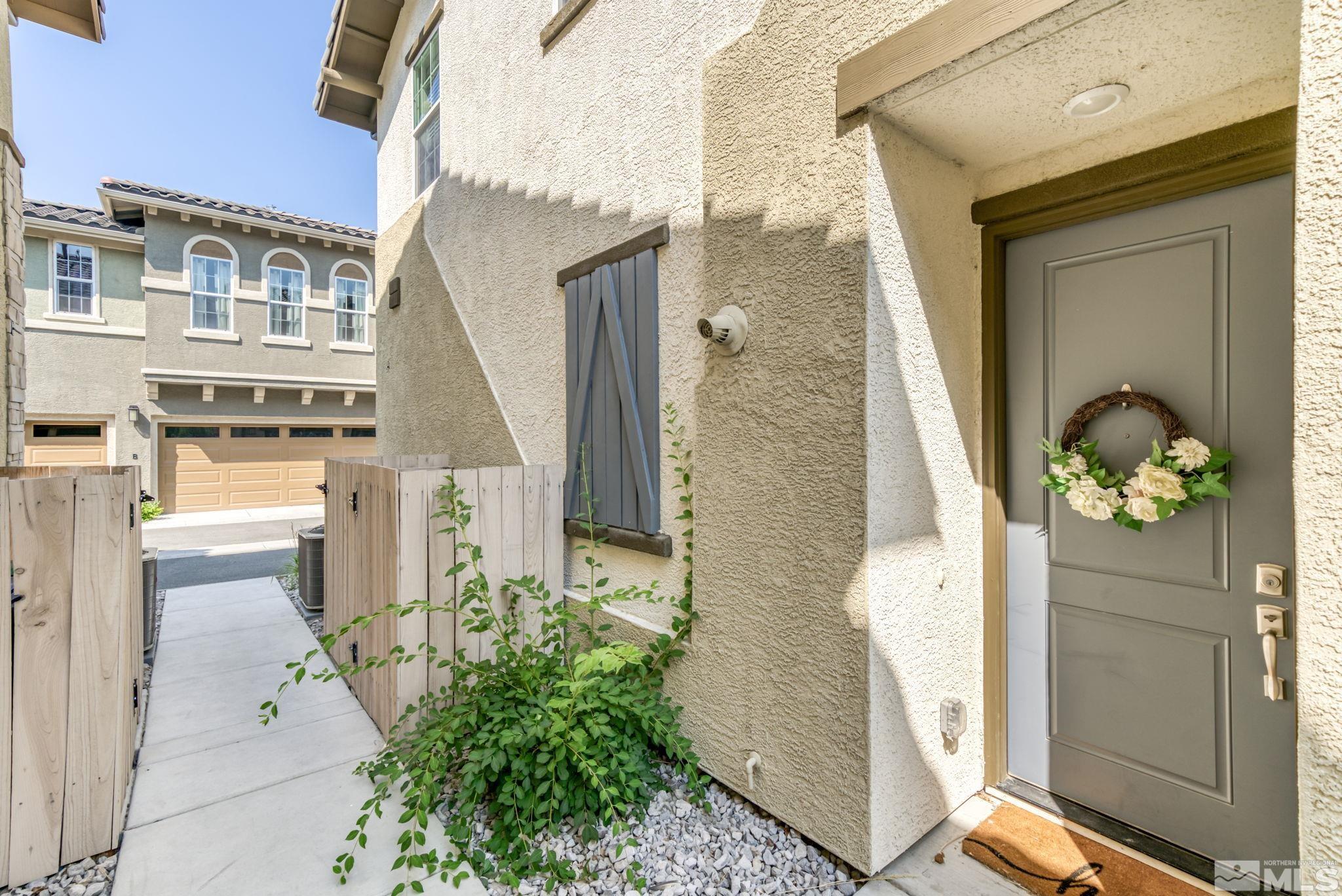 1914 Sea Horse Road, Unit A Reno, NV 89521 - Photo 23 of 28 a front view of a house with outdoor seating