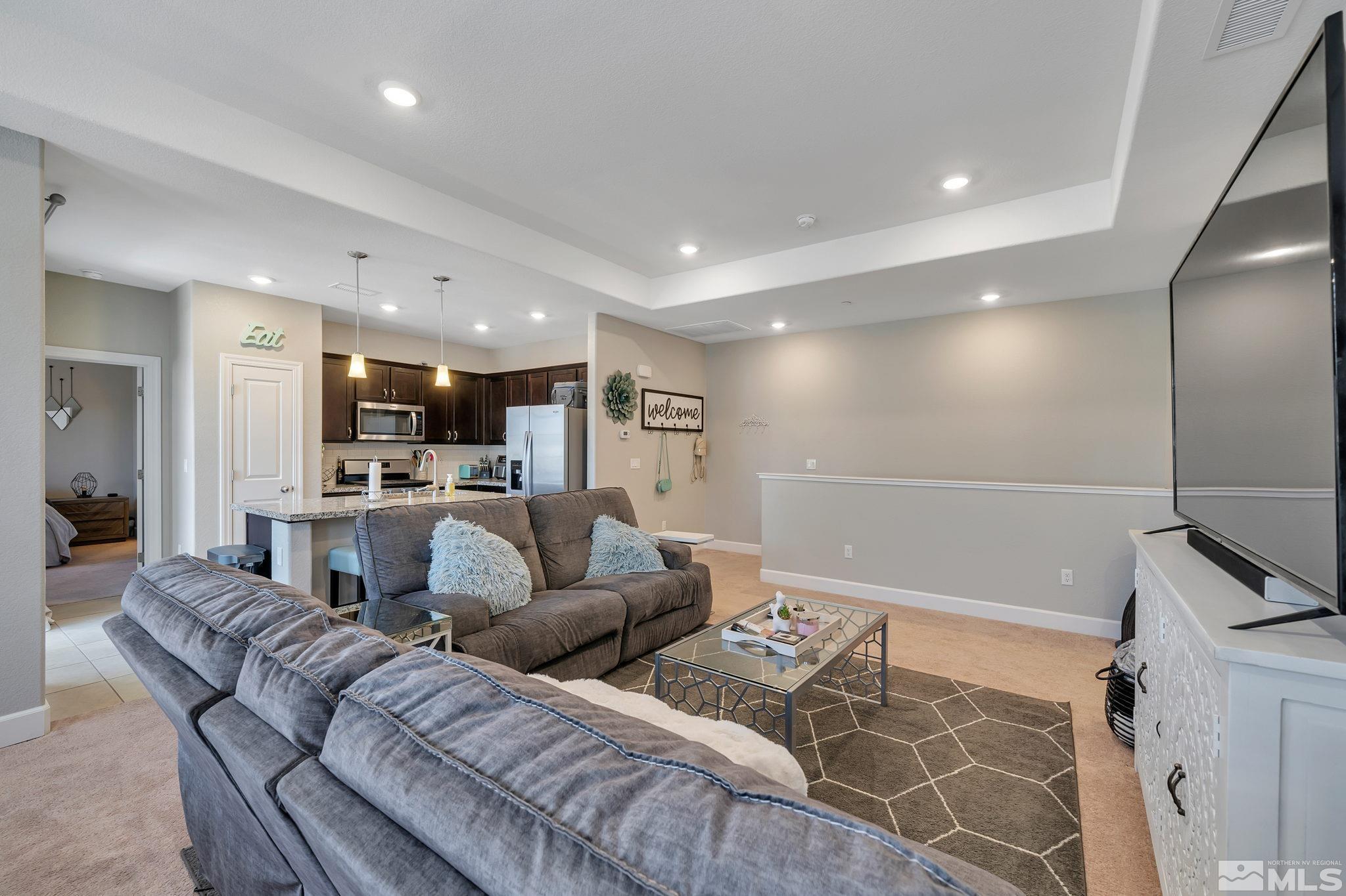 1914 Sea Horse Road, Unit A Reno, NV 89521 - Photo 3 of 28 a living room with furniture and kitchen view