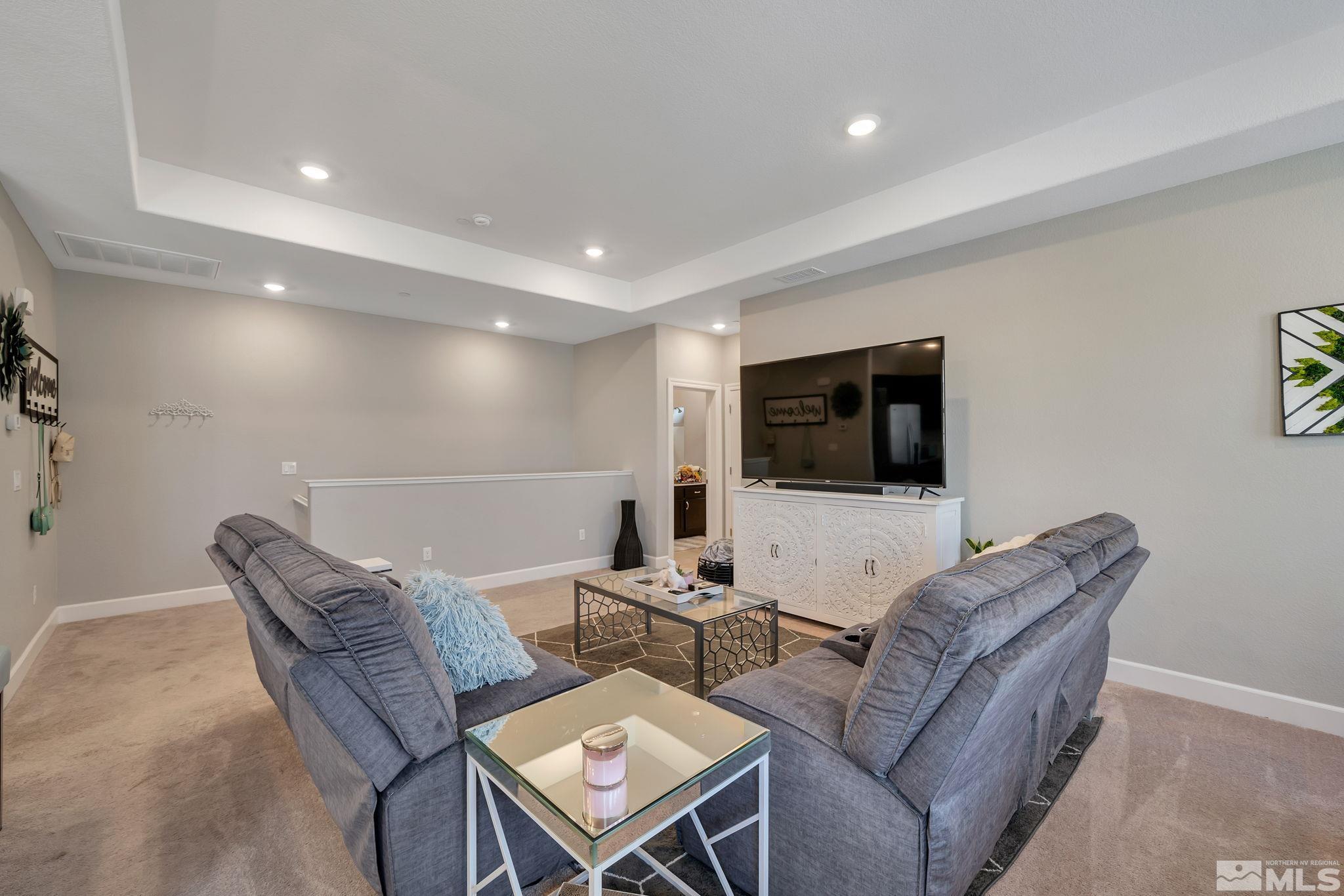 1914 Sea Horse Road, Unit A Reno, NV 89521 - Photo 4 of 28 a living room with furniture and a flat screen tv