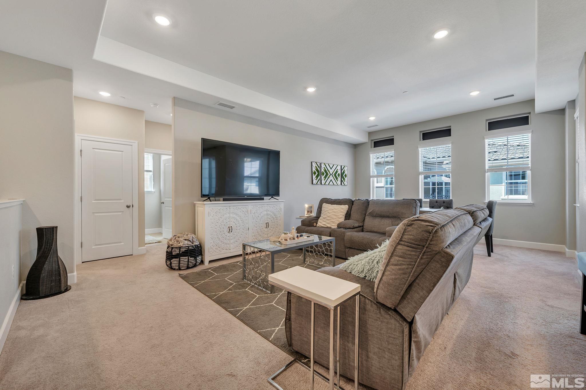 1914 Sea Horse Road, Unit A Reno, NV 89521 - Photo 10 of 28 a living room with furniture and a flat screen tv
