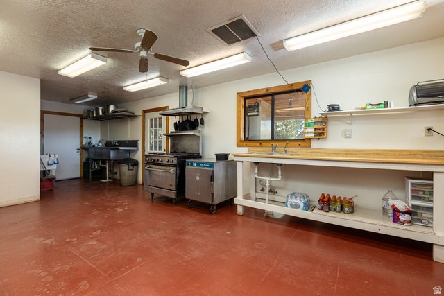 2040 North Long Cyn Road Kanab, UT 84741 - Photo 14 of 23 Garage with a ceiling fan and a sink