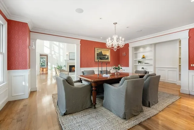 a view of a dining room with furniture wooden floor and chandelier