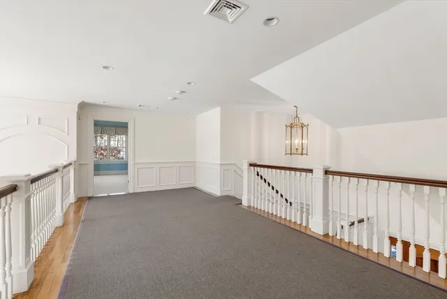 a view of a hallway with an entryway