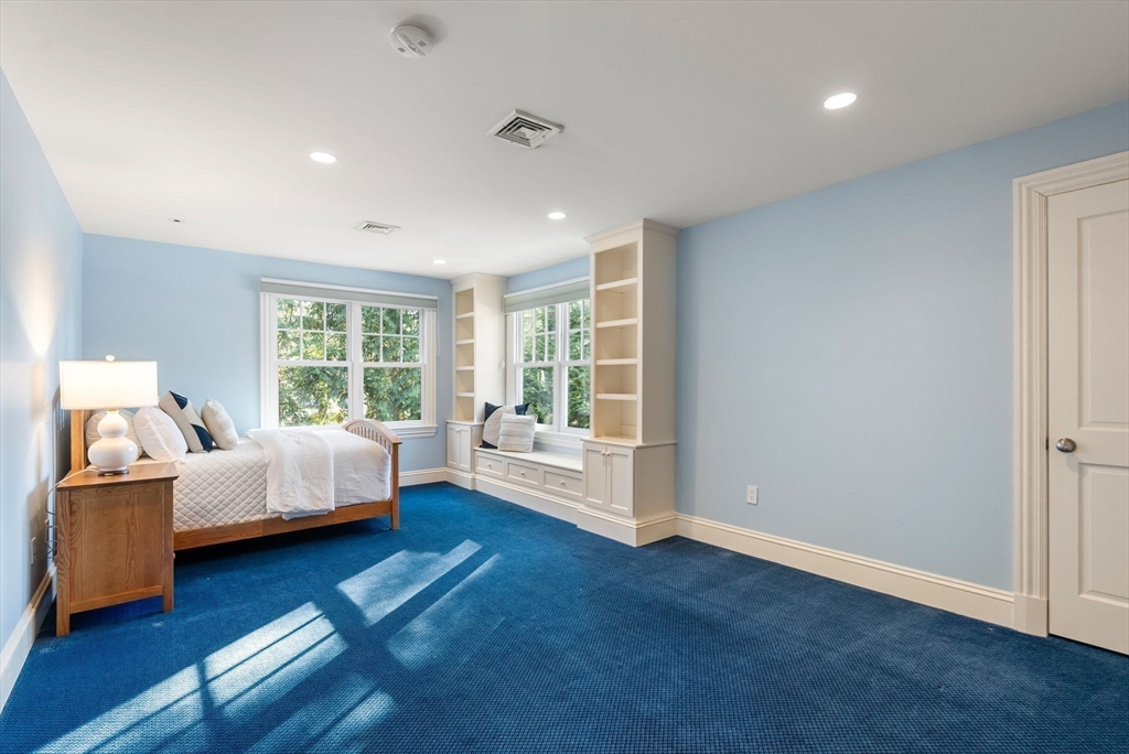182 Winding River Road Wellesley, MA 02482 - Photo 29 of 40 a bedroom with furniture and a large window