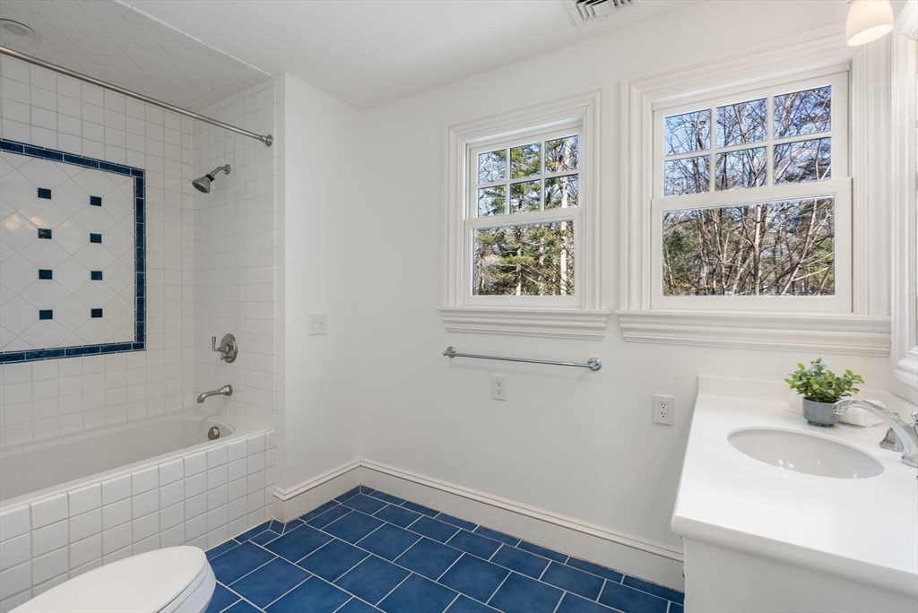 182 Winding River Road Wellesley, MA 02482 - Photo 30 of 40 a bathroom with a sink a toilet and a bathtub