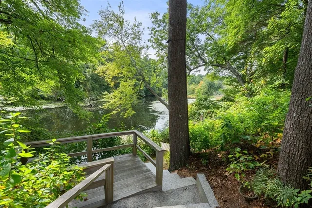 a view of balcony with yard and outdoor seating
