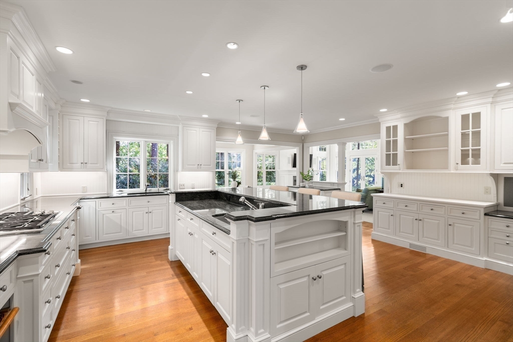182 Winding River Road Wellesley, MA 02482 - Photo 5 of 40 a kitchen with stainless steel appliances kitchen island granite countertop a sink and cabinets