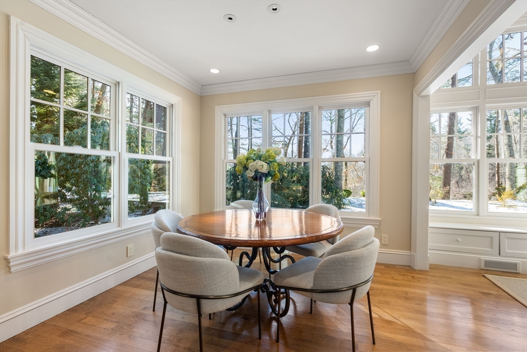 182 Winding River Road Wellesley, MA 02482 - Photo 9 of 40 a dining room with furniture window and wooden floor