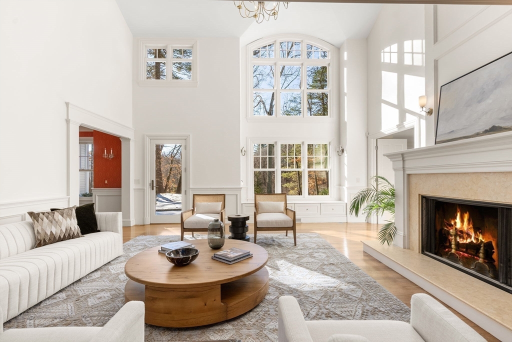 182 Winding River Road Wellesley, MA 02482 - Photo 10 of 40 a living room with furniture and a fireplace