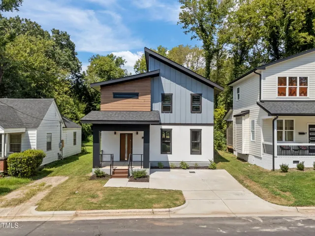 a house that has a tree in front of it