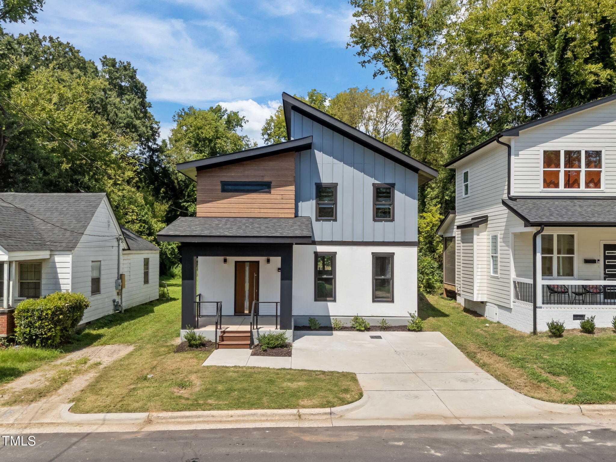 a house that has a tree in front of it