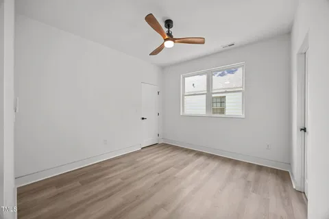 a workspace with furniture window and wooden floor