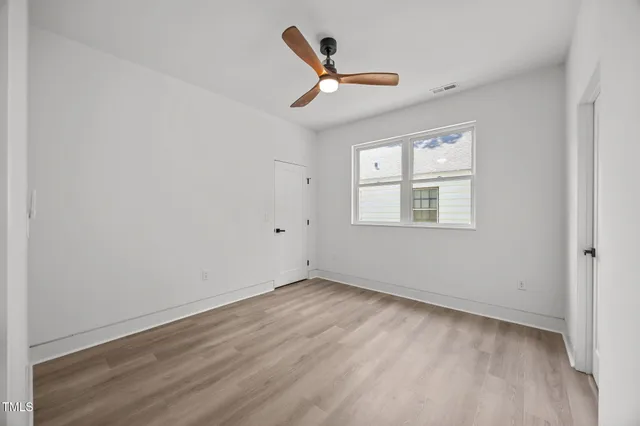 a workspace with furniture window and wooden floor