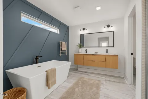 a bathroom with a bathtub and a shower