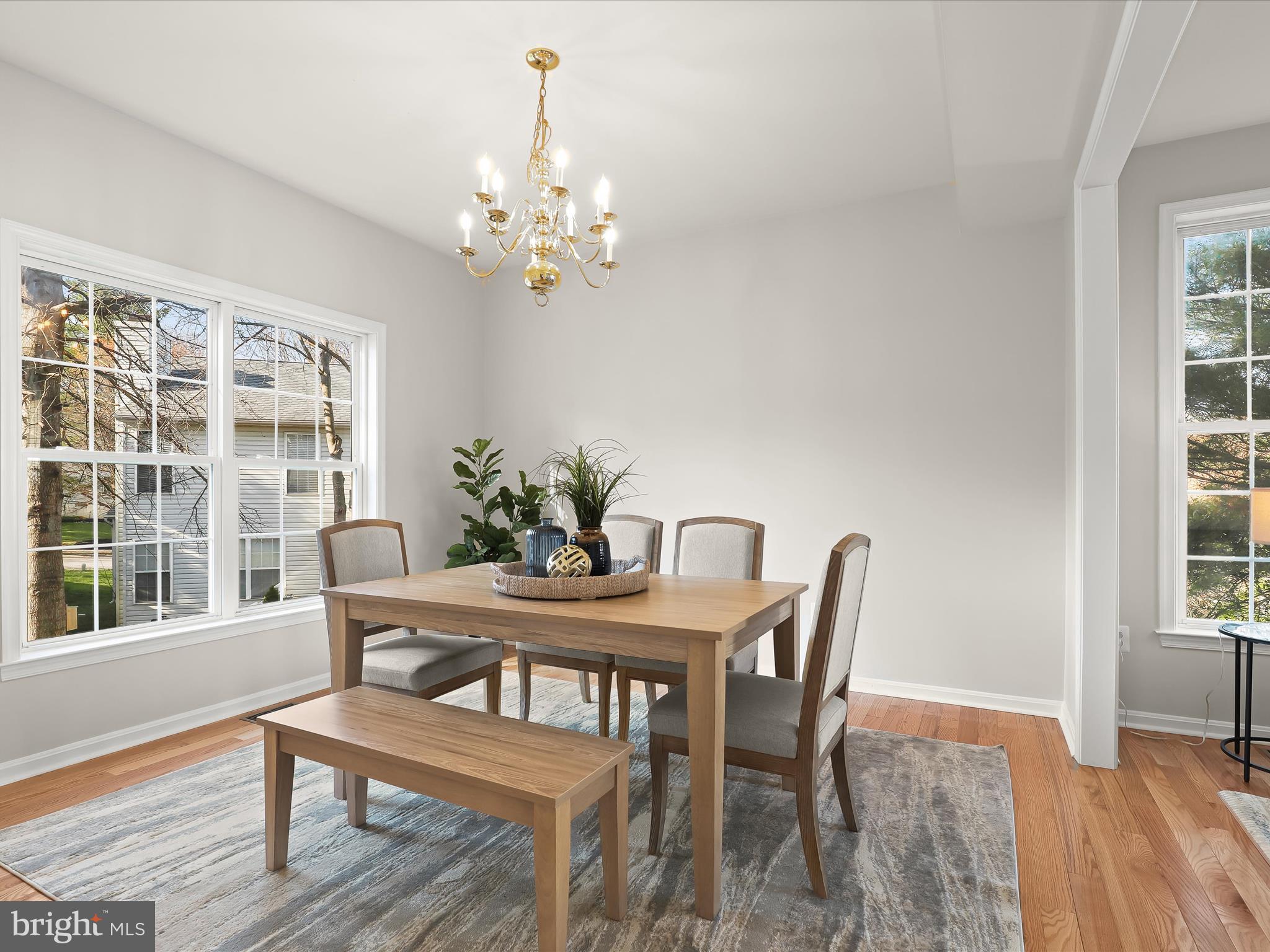 6413 Phantom Moon Walk Clarksville, MD 21029 - Photo 13 of 60 a view of a dining room with furniture window and wooden floor