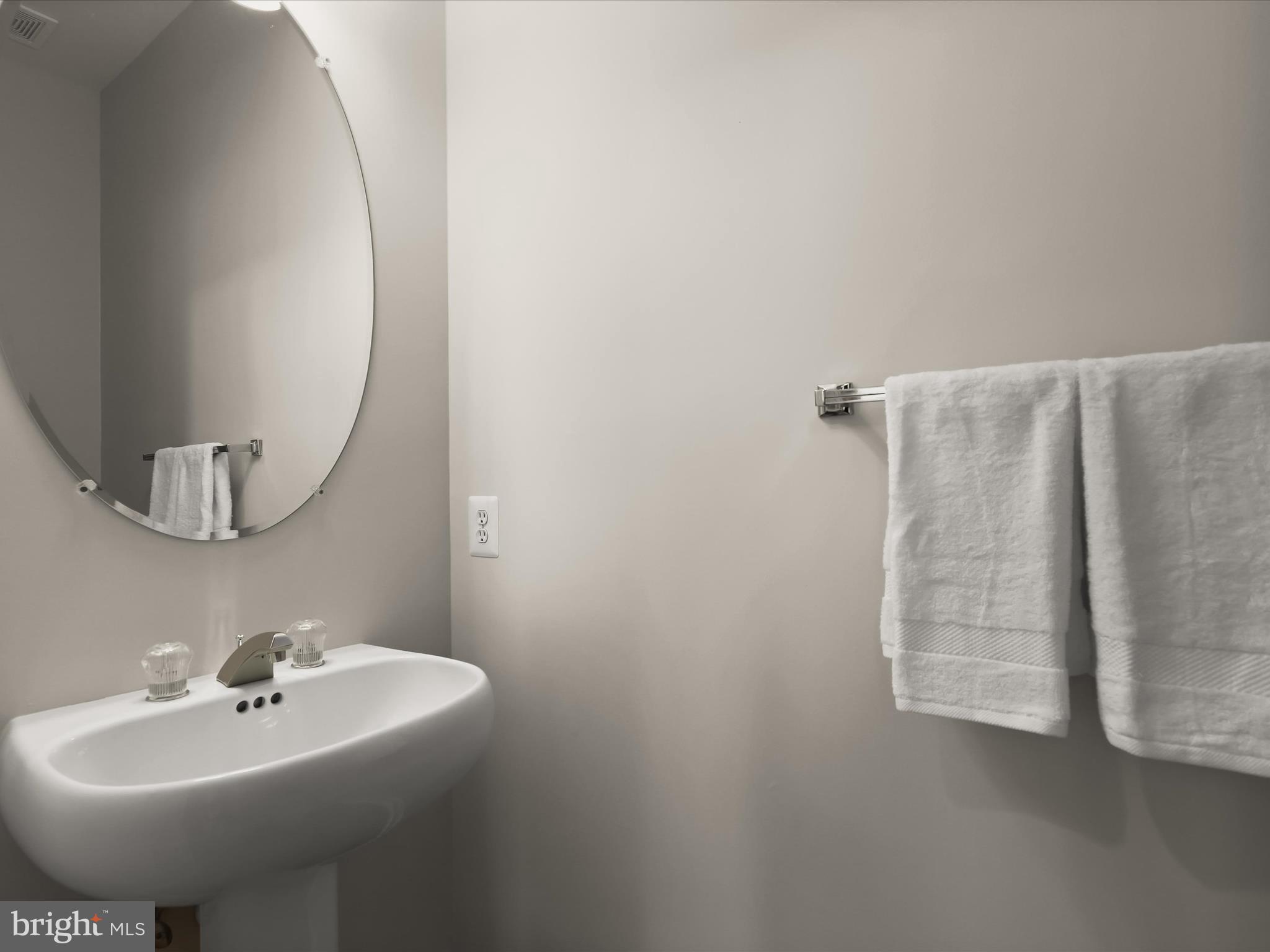 6413 Phantom Moon Walk Clarksville, MD 21029 - Photo 26 of 60 a bathroom with a sink and mirror