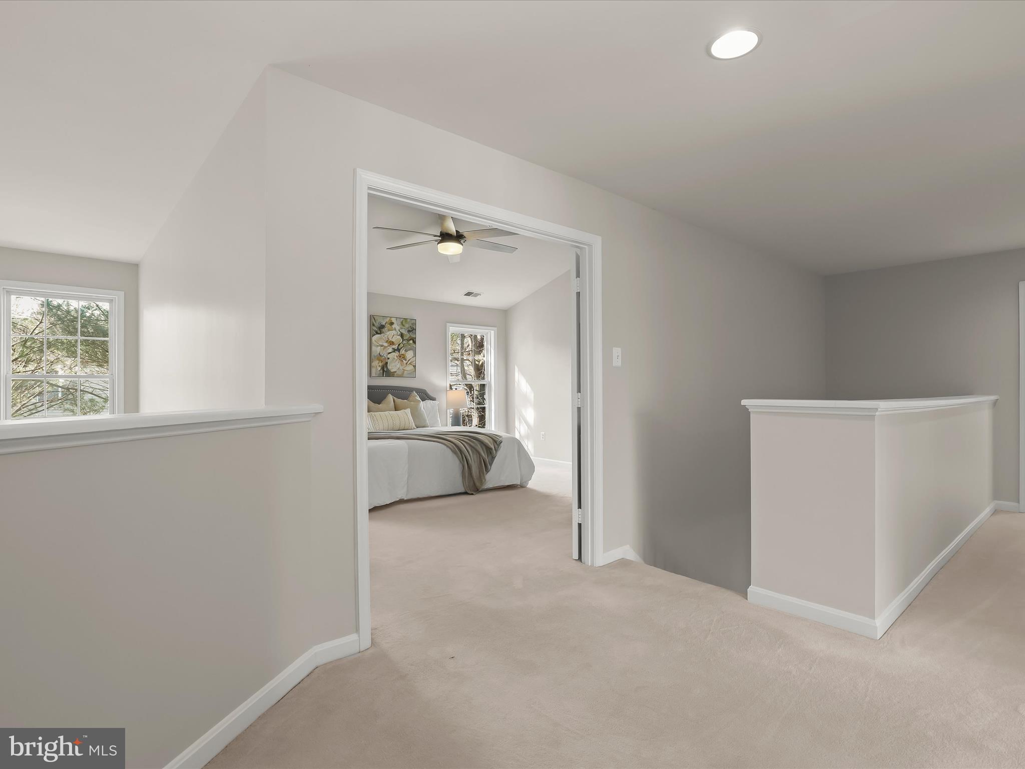 6413 Phantom Moon Walk Clarksville, MD 21029 - Photo 30 of 60 a view of a bedroom with a bed and a window