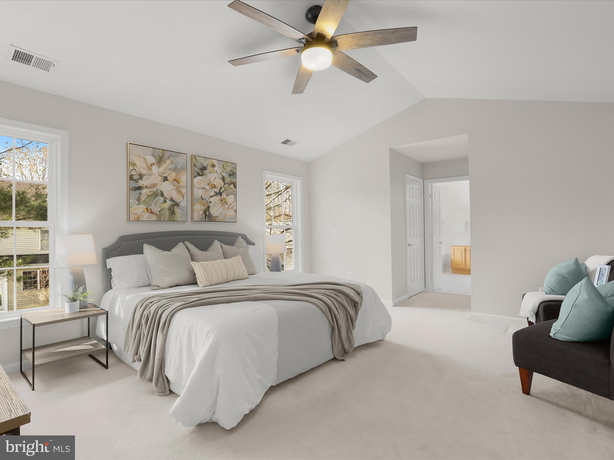 6413 Phantom Moon Walk Clarksville, MD 21029 - Photo 32 of 60 a spacious bedroom with a bed and a chandelier