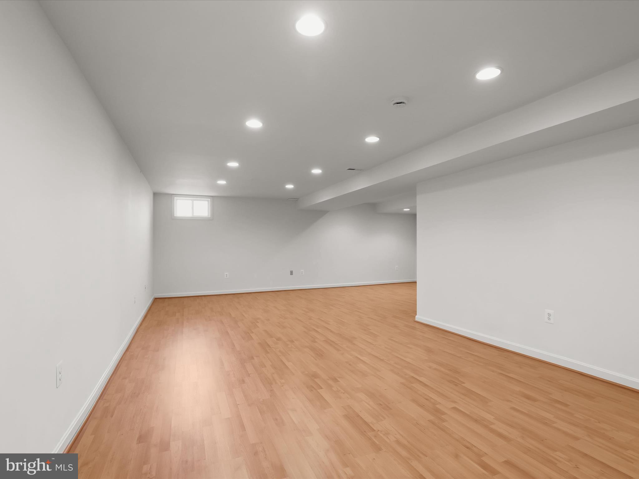 6413 Phantom Moon Walk Clarksville, MD 21029 - Photo 43 of 60 an empty room with wooden floor and windows