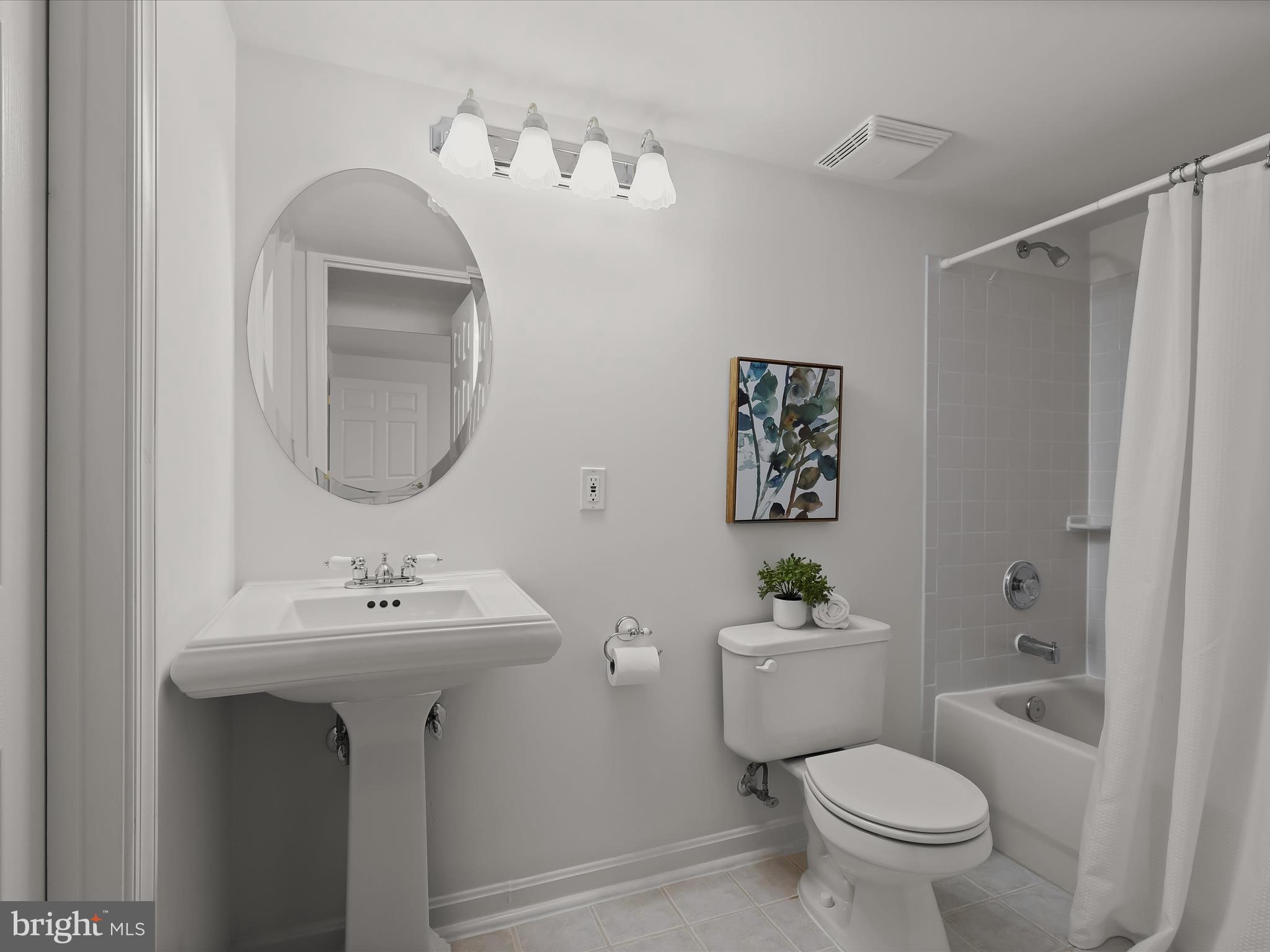 6413 Phantom Moon Walk Clarksville, MD 21029 - Photo 48 of 60 a bathroom with a toilet a sink and mirror