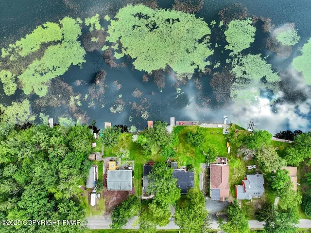 a view of a lake with a yard