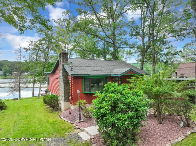 a view of outdoor space with yard and lake view