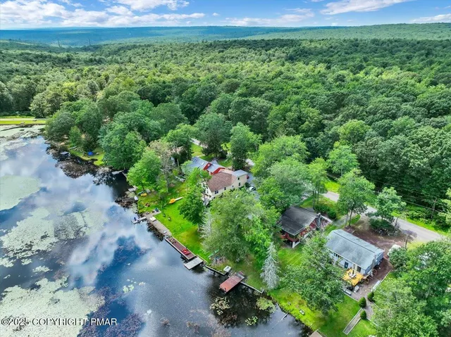 a living room with furniture and stairs