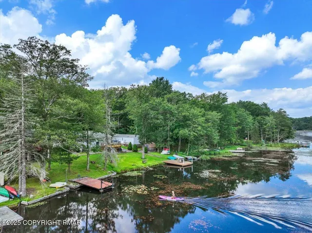 a view of a house with a small yard and plants