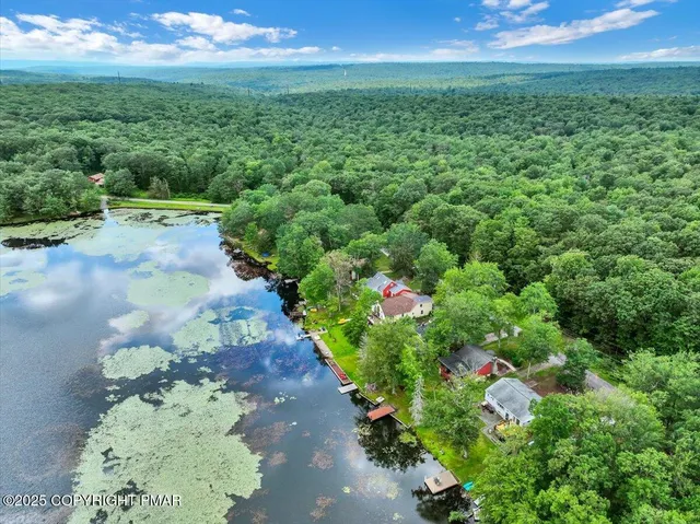 a kitchen with a refrigerator a stove a microwave and cabinets