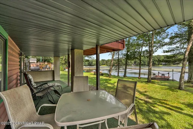 a view of a livingroom with furniture and staircase