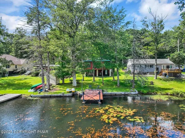 a view of a lake with a yard