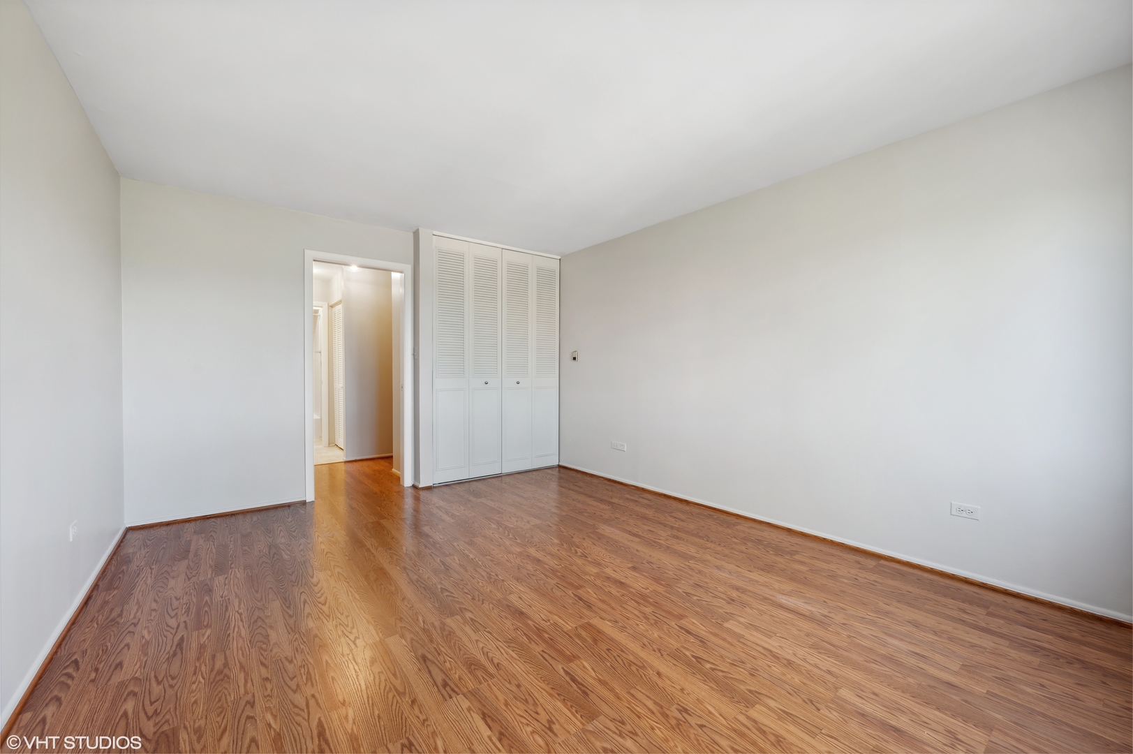 250 Ridge Avenue, Unit 5F Evanston, IL 60202 - Photo 13 of 19 a view of an empty room and wooden floor