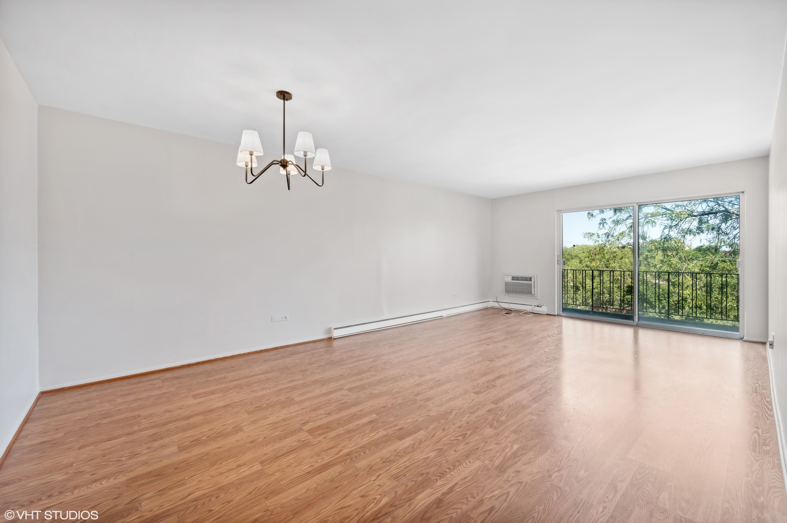 250 Ridge Avenue, Unit 5F Evanston, IL 60202 - Photo 4 of 19 wooden floor in an empty room with a window