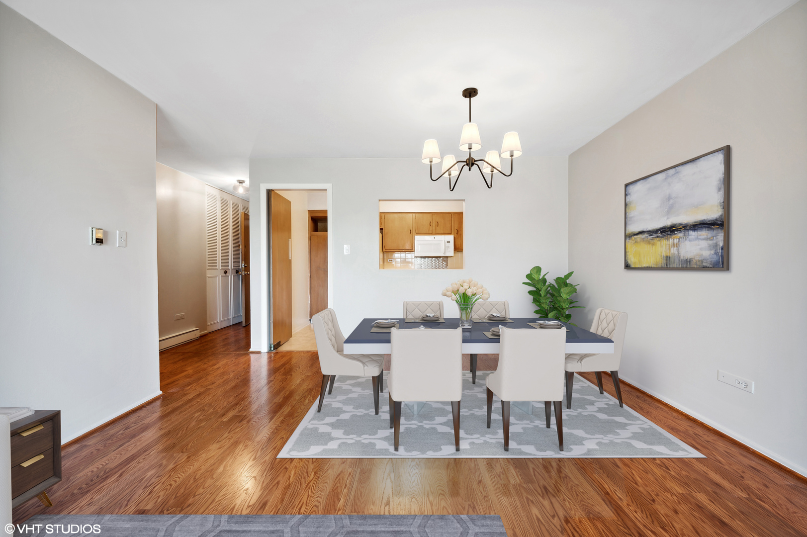 250 Ridge Avenue, Unit 5F Evanston, IL 60202 - Photo 8 of 19 a view of a dining room with furniture and wooden floor