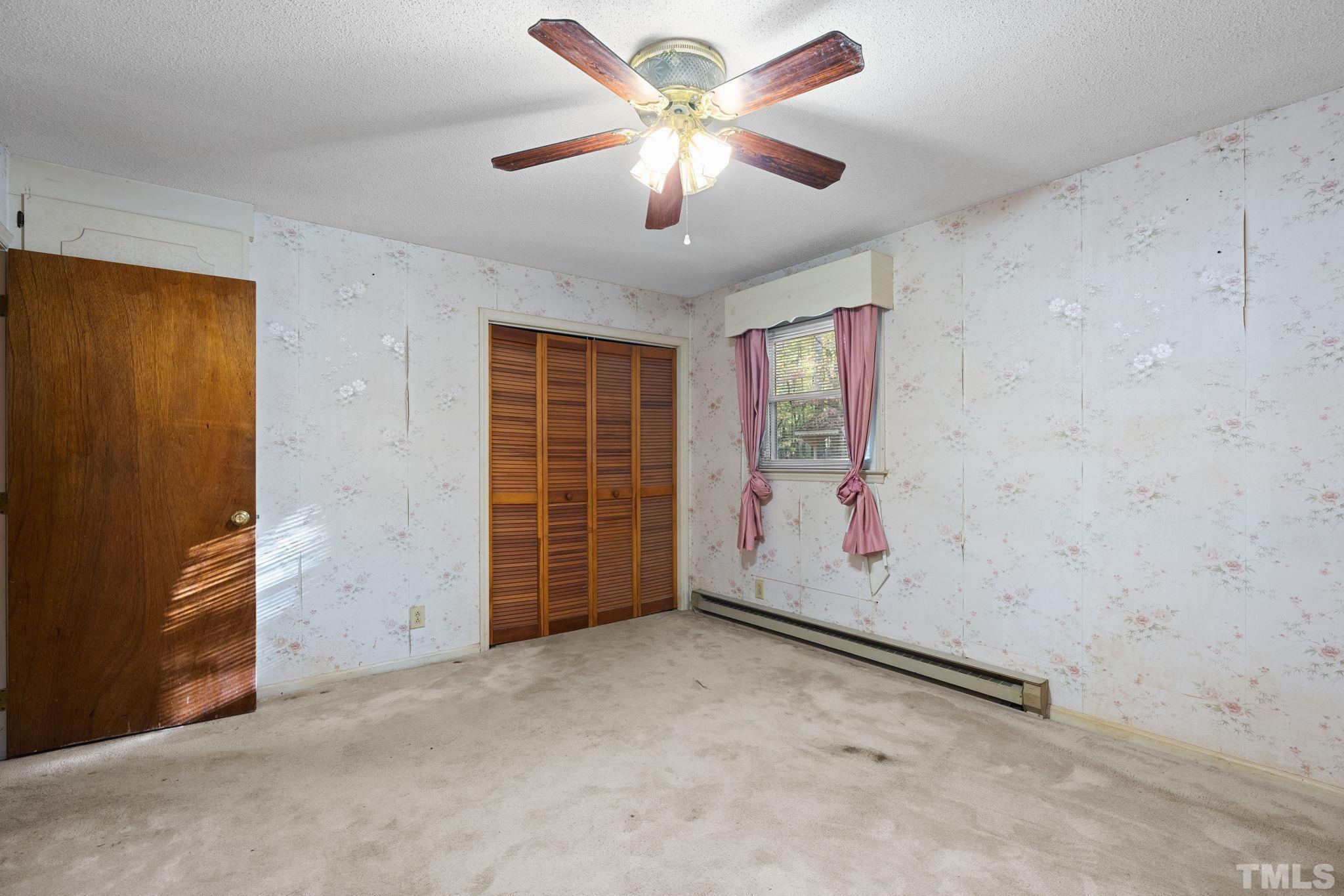 5930 Guess Road Durham, NC 27712 - Photo 17 of 43 an empty room with windows and fan