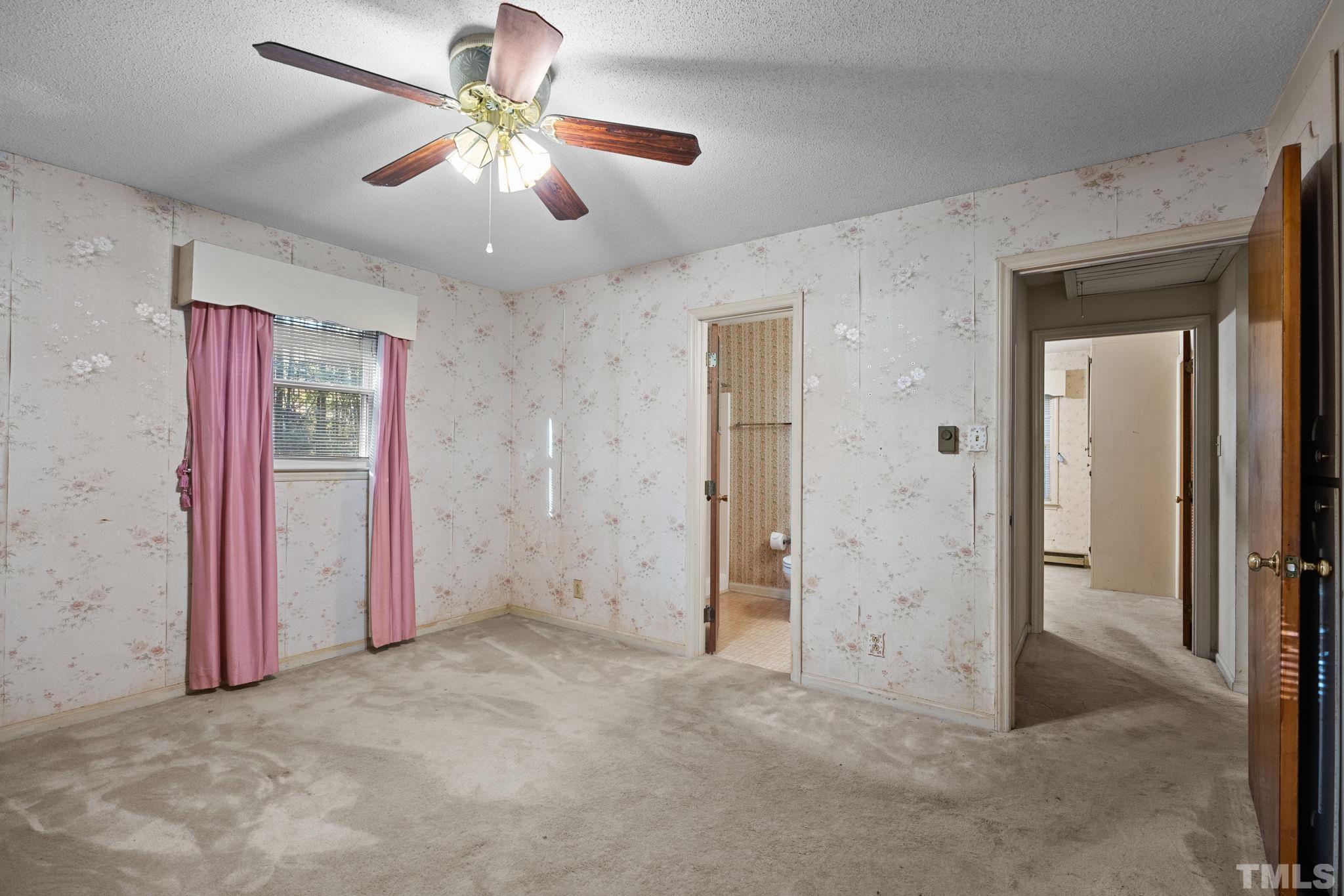 5930 Guess Road Durham, NC 27712 - Photo 18 of 43 an empty room with closet and a ceiling fan