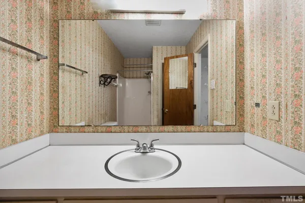 a bathroom with a sink and a mirror