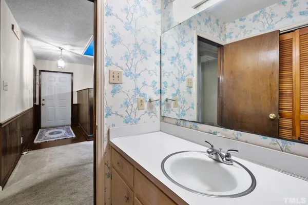 a bathroom with a sink and a mirror