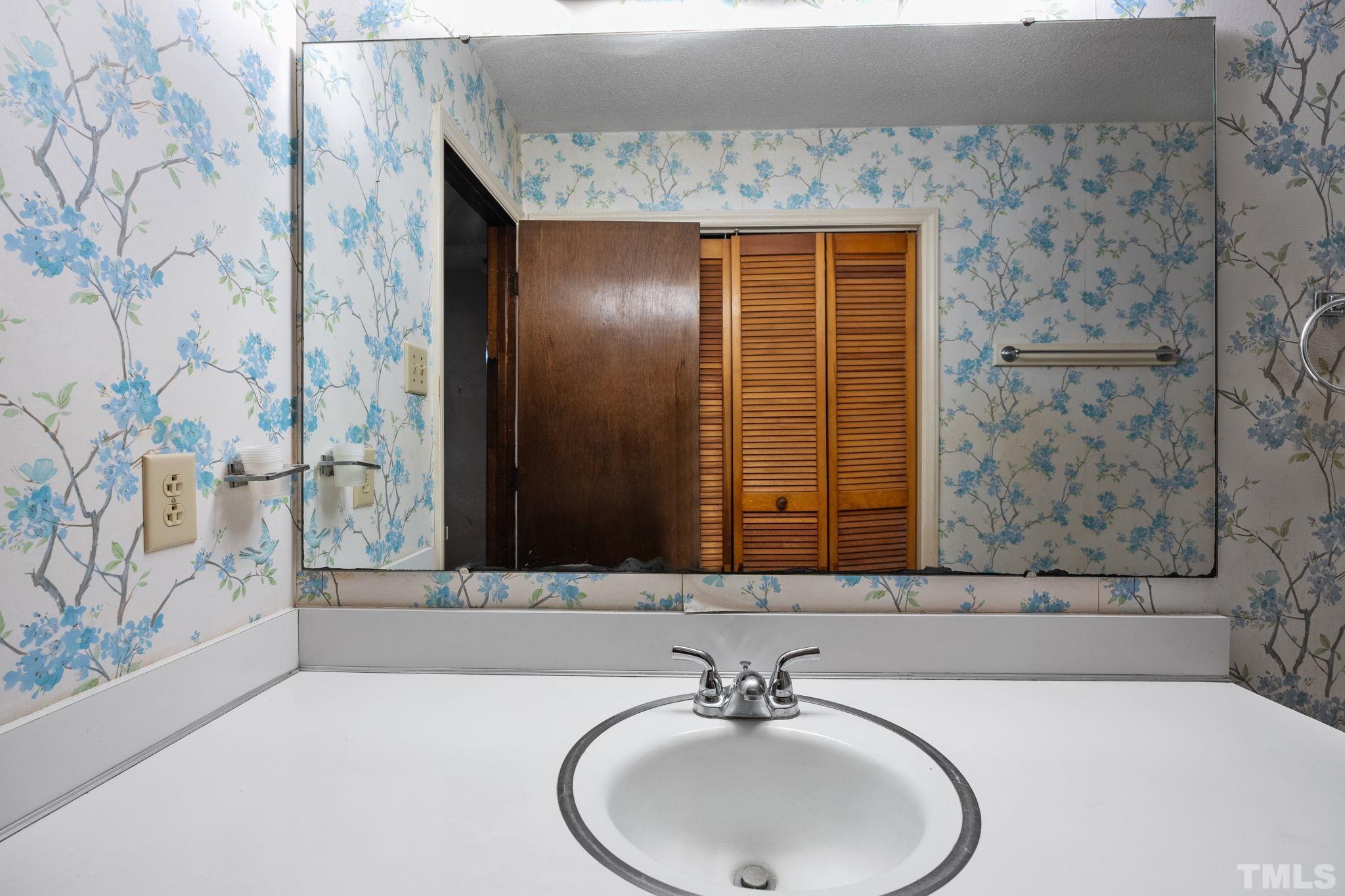 5930 Guess Road Durham, NC 27712 - Photo 28 of 43 a bathroom with a sink and a mirror
