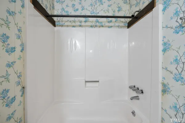 a bathroom with a shower curtain