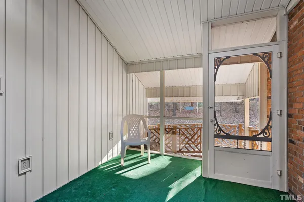 a view of a deck with a backyard