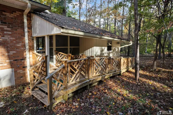a balcony with lots of flowers