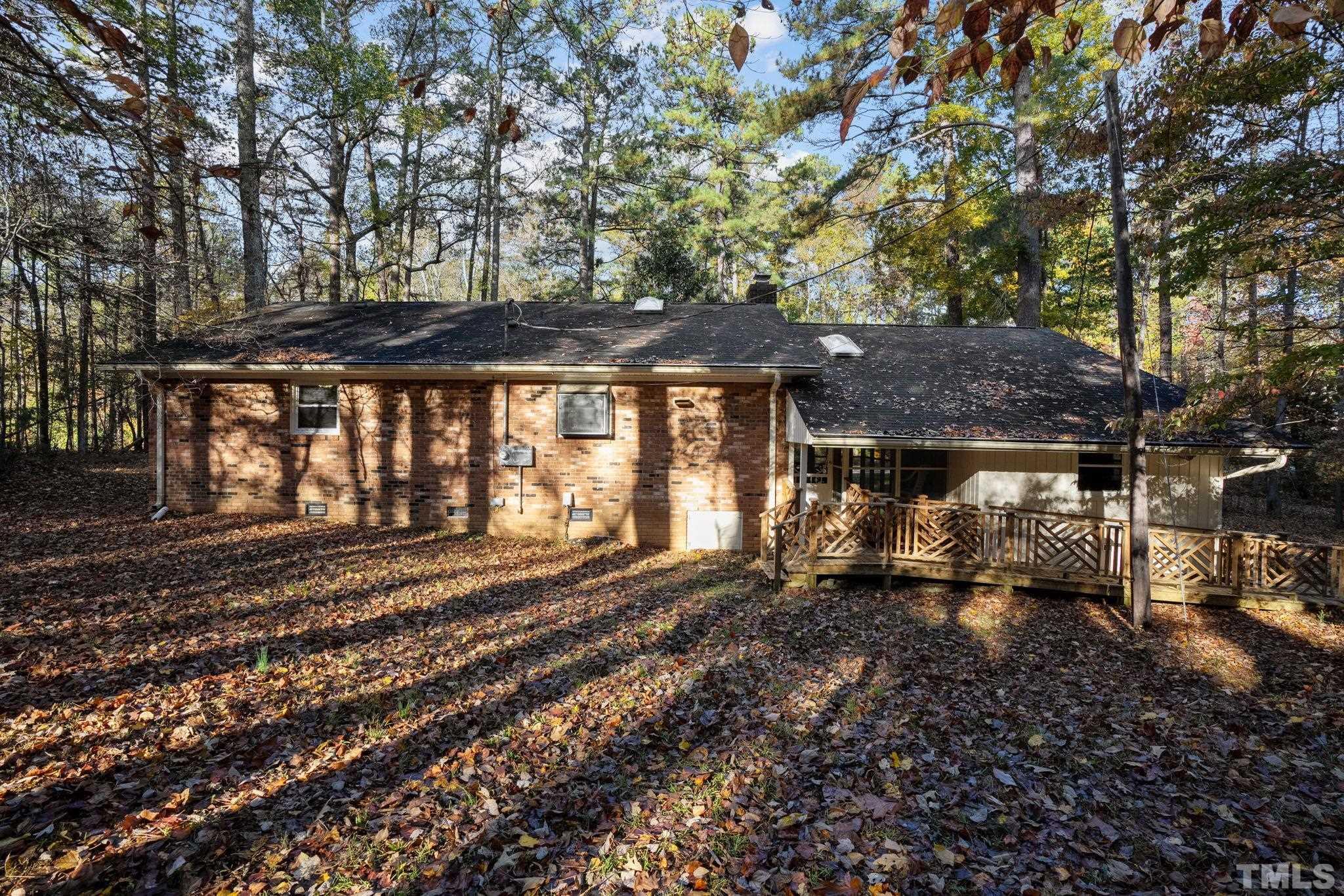 5930 Guess Road Durham, NC 27712 - Photo 40 of 43 a front view of a house with a garden